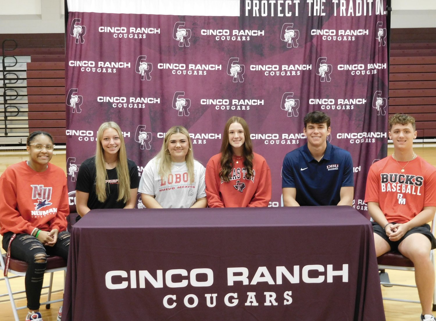Danielle Williams, Dalen Jensen, Charlie Atkinson, Amanda Croteau, Chela Kovar and Courtney O'Brien pose for a photo during Cinco Ranch's national signing day.